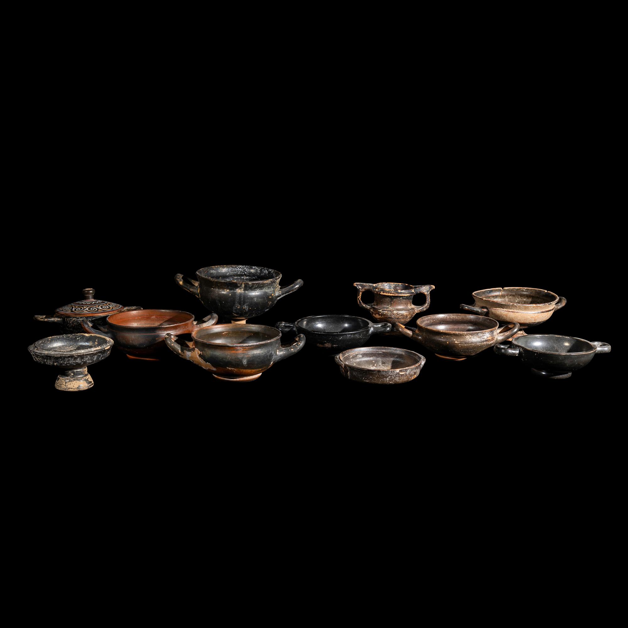 Eleven Greek Black-Glazed Vessels and Lids