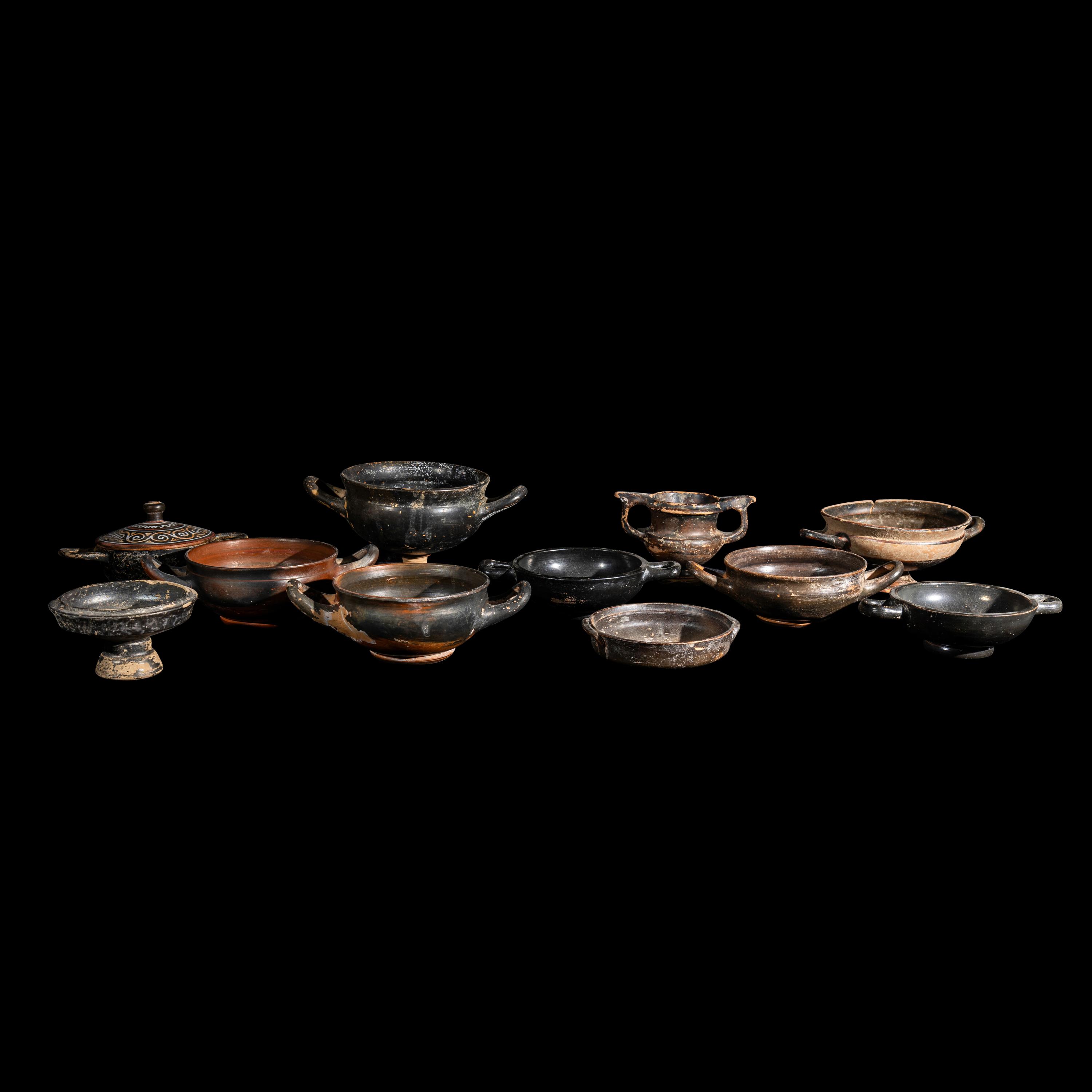 Eleven Greek Black-Glazed Vessels and Lids
