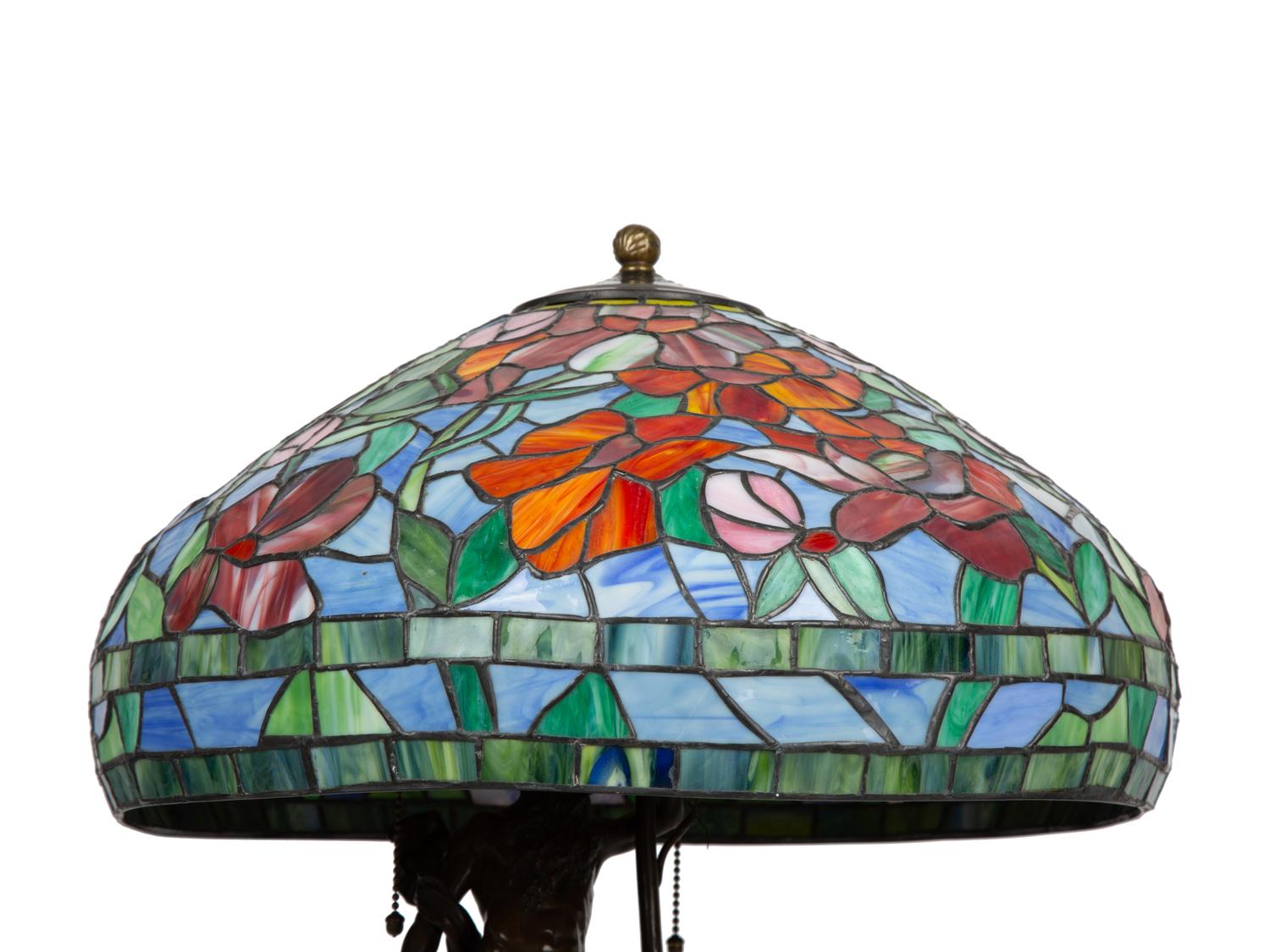 A Bronze Figural Table Lamp with Leaded Glass Shade — SECOND HALF 20TH CENTURY