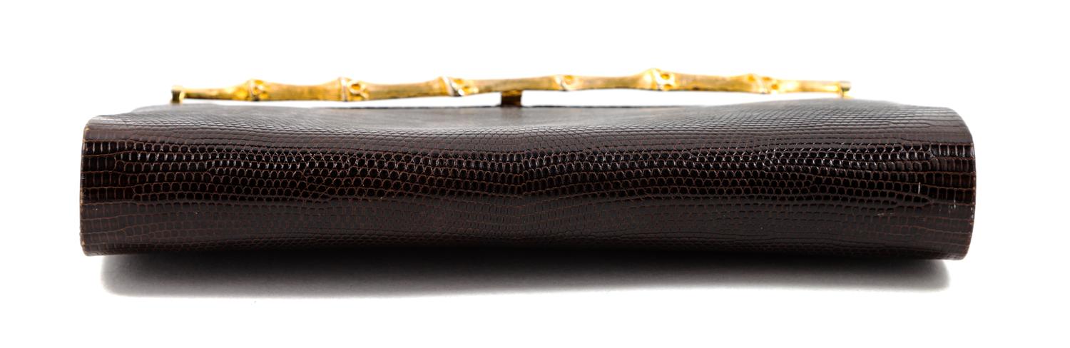A Gucci Brown Snakeskin Clutch, 4.75" H x 8.25" W x 1.25" D.