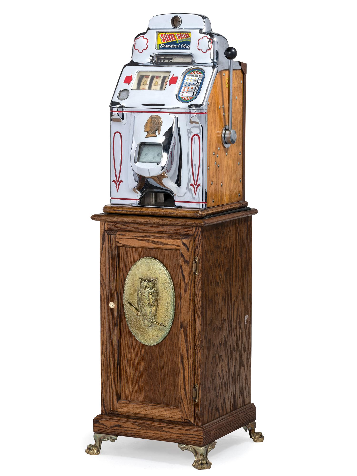 A Silver Dollar Standard Chief Slot Machine on Stand
