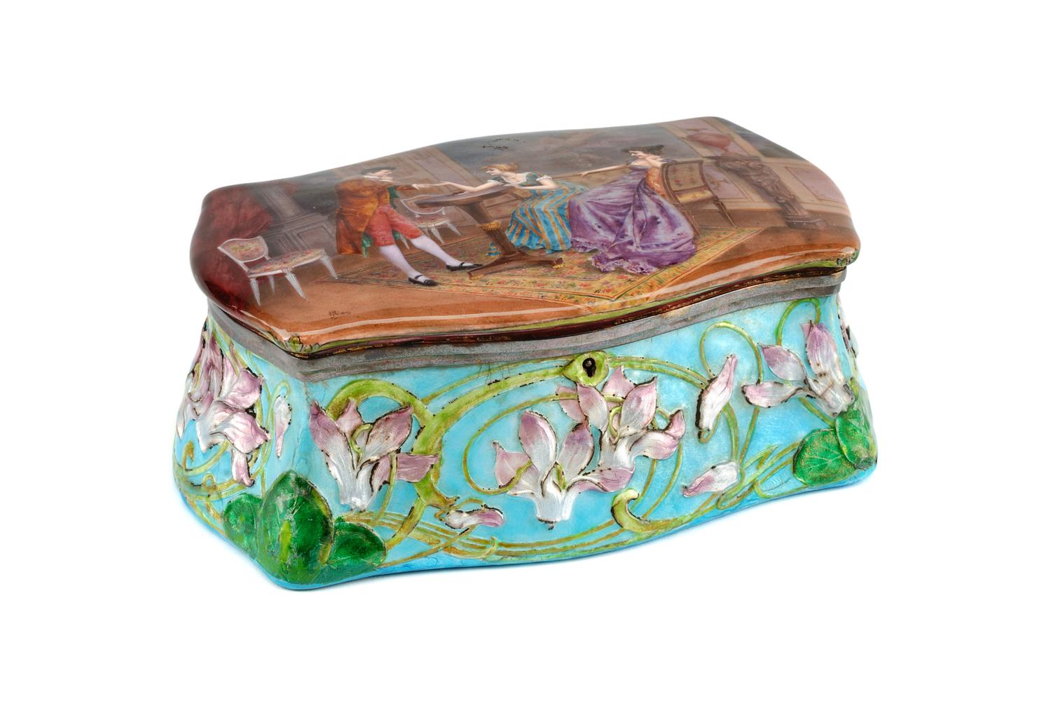 An Austrian Enameled Silver Jewelry Box, , of serpentine outline, the hinged top enameled to show a gentleman and two ladies in an inte