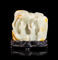 A Chinese Celadon and Russet Jade Boulder