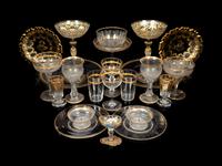 A Set of Eight Venetian Enameled Glass Champagne Coupes and a Group of Gilt Decorated Glass Table Articles