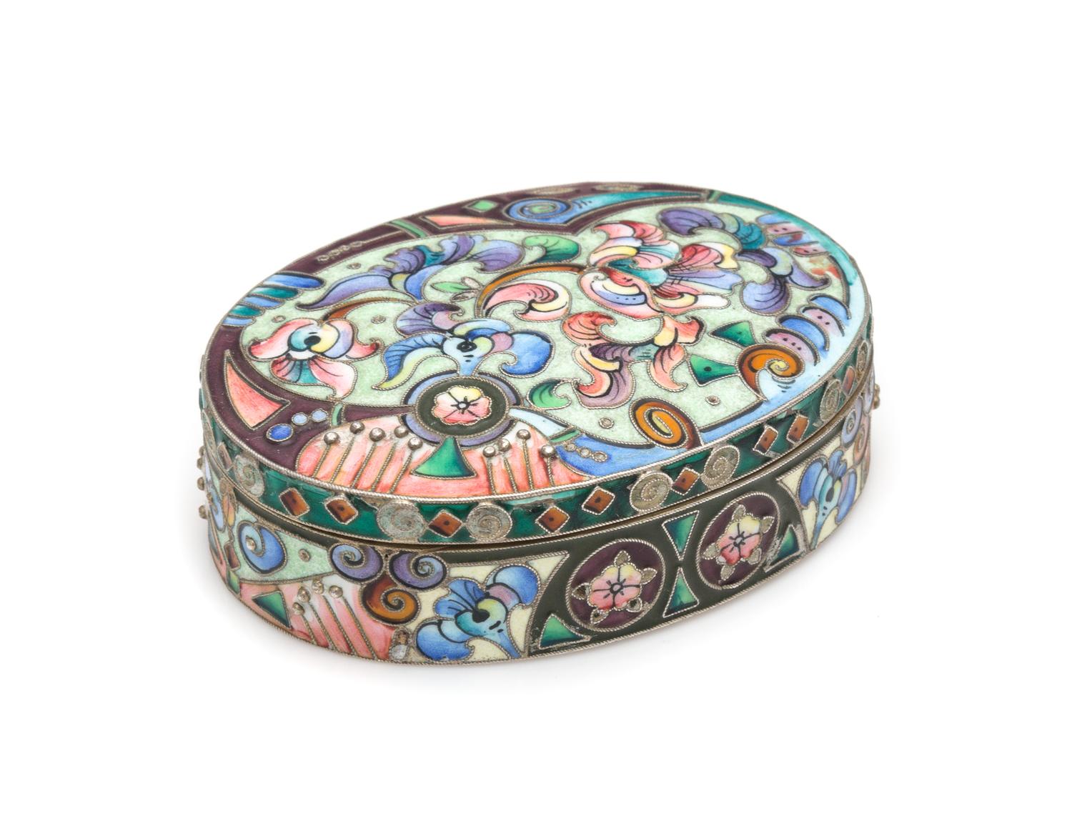 A Russian Enameled Silver Snuff Box, Mark of the 6th Artel, Moscow, Early 20th Century, of oval form, having polychrome enameled foliat