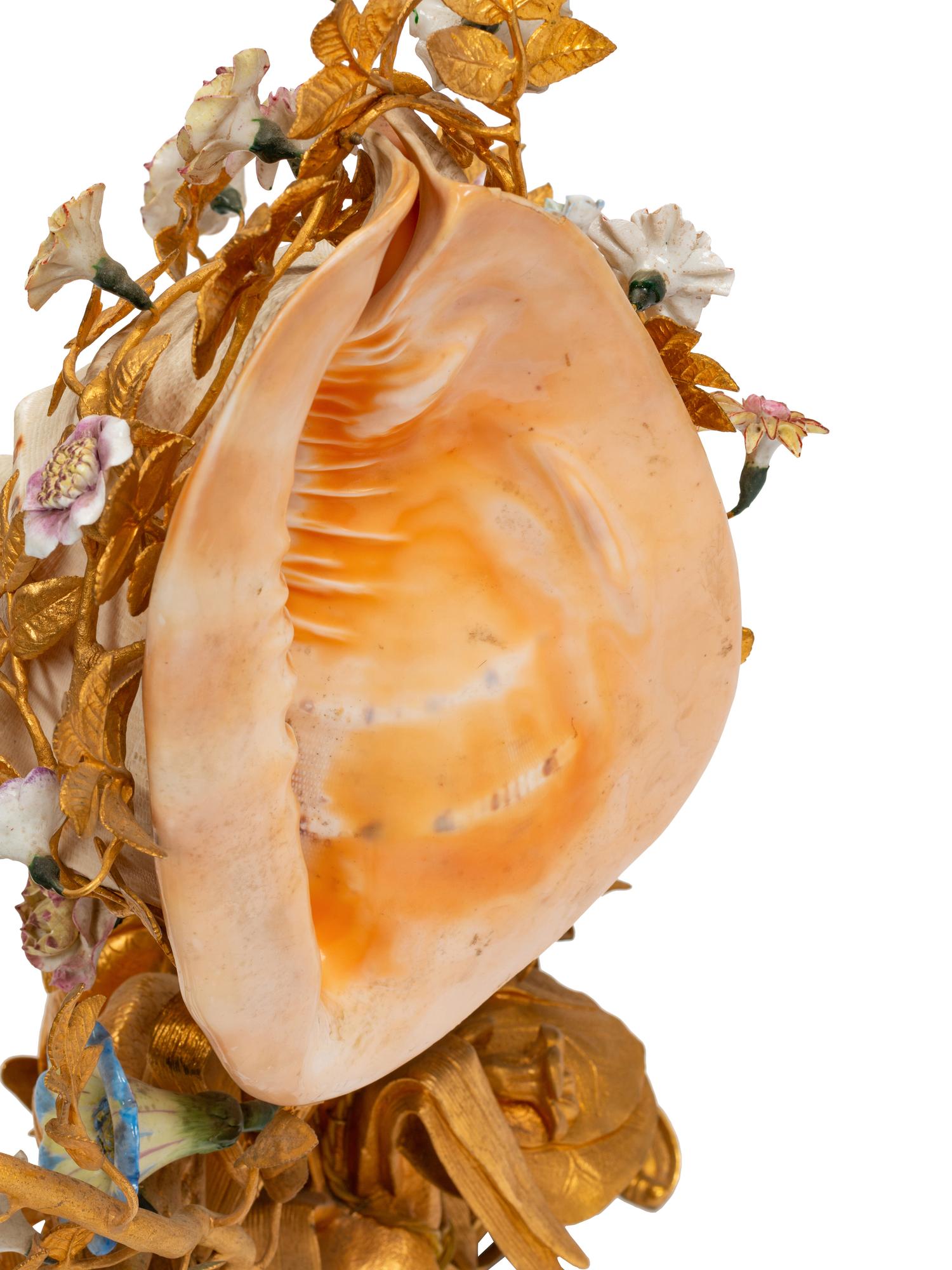 A Louis XV Style Gilt Bronze, Porcelain and Seashell Mounted Sea Motif Lamp