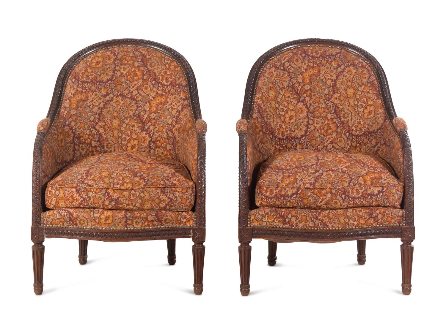 A Pair of Louis XVI Style Carved Mahogany Bergères