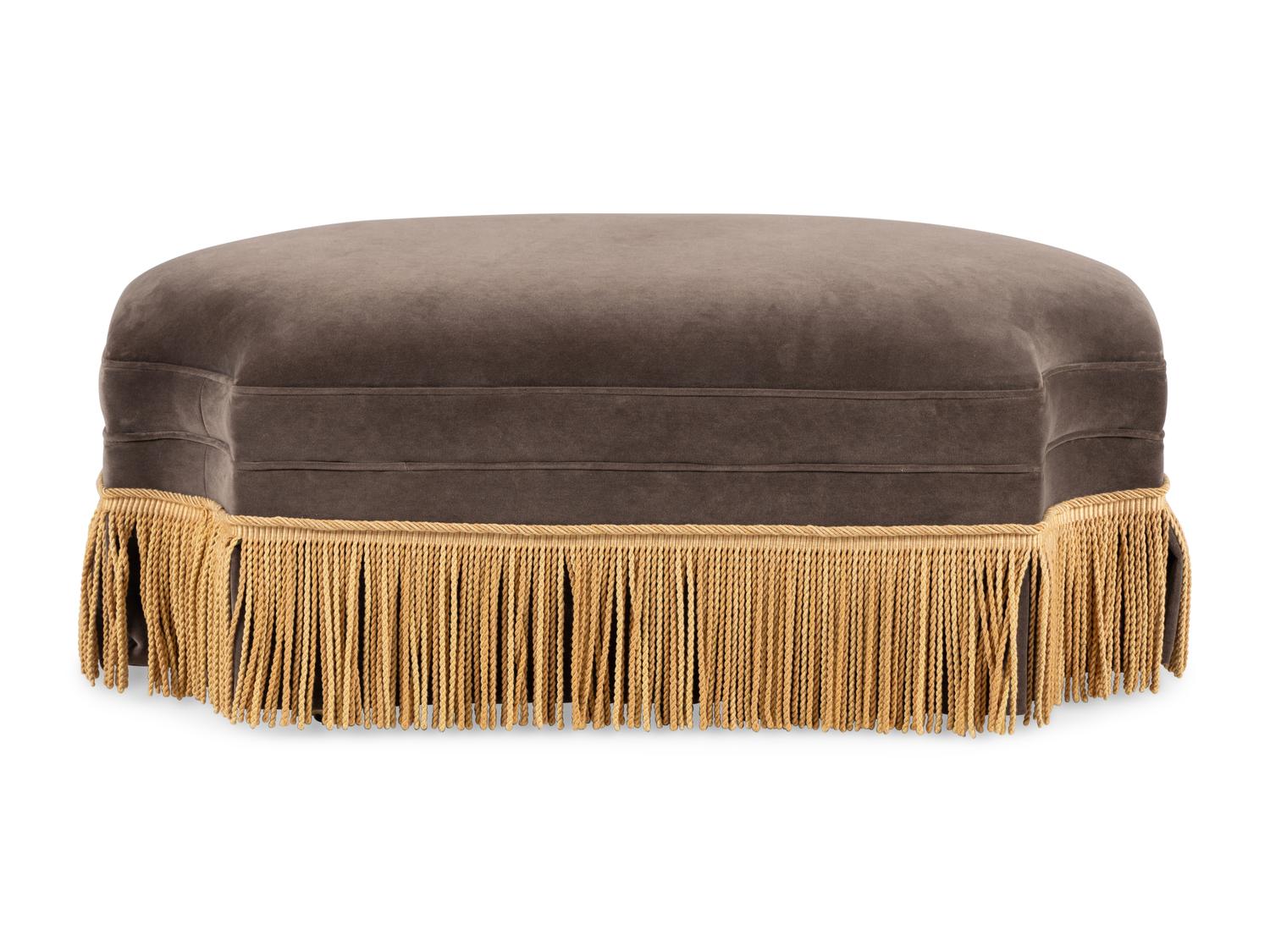 A Contemporary Velvet Upholstered Ottoman with Boullion Fringe