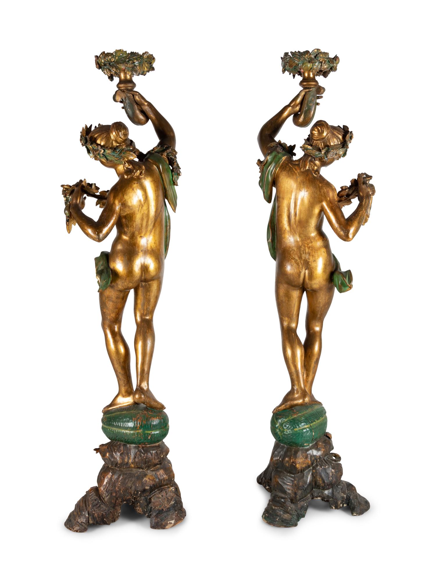 A Pair of Continental Gilt and Polychromed Figural Torchères