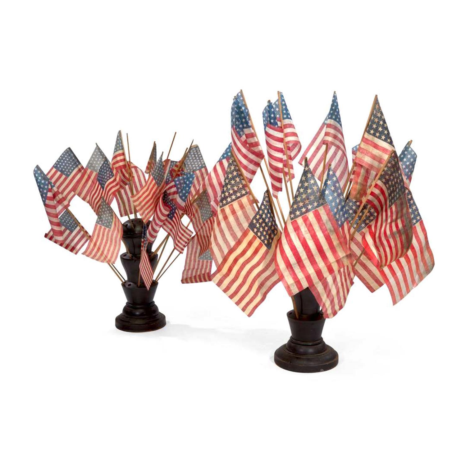 [FLAGS]. A near pair of turned wooden flag holders. Late 19th-early 20th century.