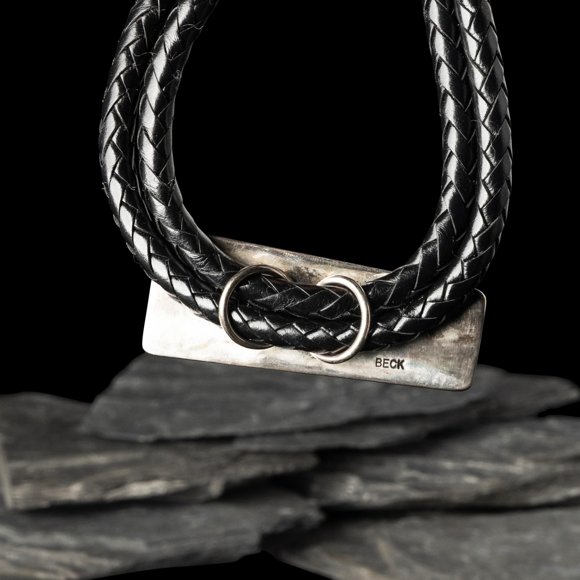 Victor Beck (Diné, 1941-2022) — Fluted Silver Bolo Tie with Inlay