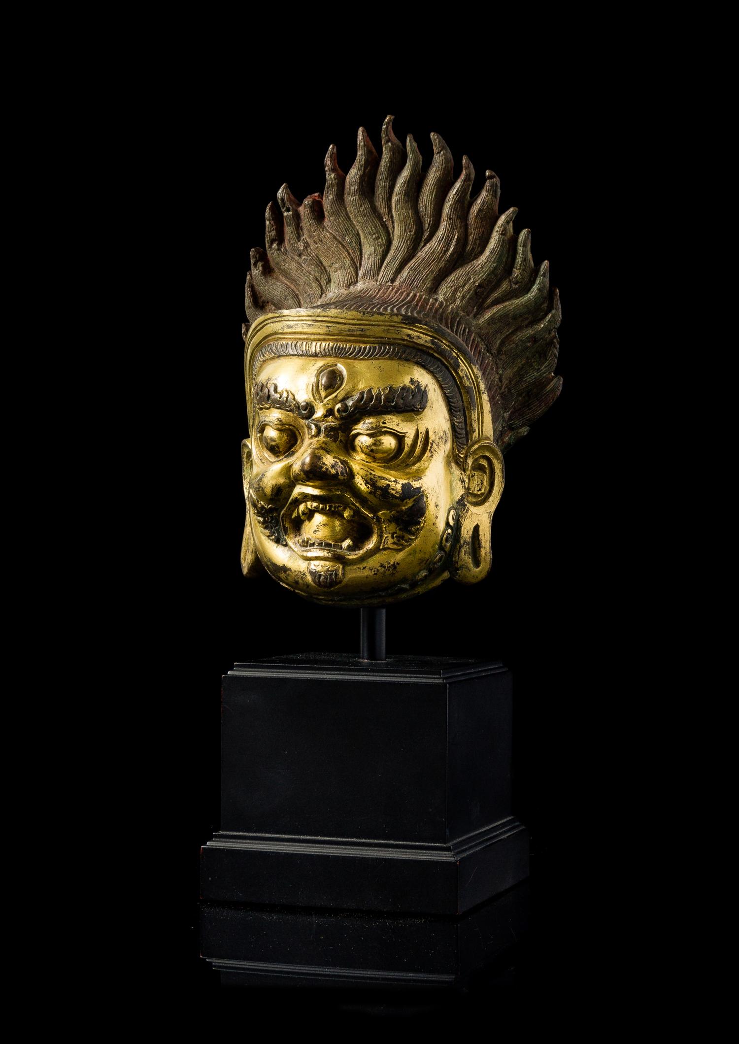 A Sino-Tibetan Gilt Bronze Head of Bodhisattva Mahakala — 18TH/19TH CENTURY