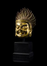A Sino-Tibetan Gilt Bronze Head of Bodhisattva Mahakala — 18TH/19TH CENTURY