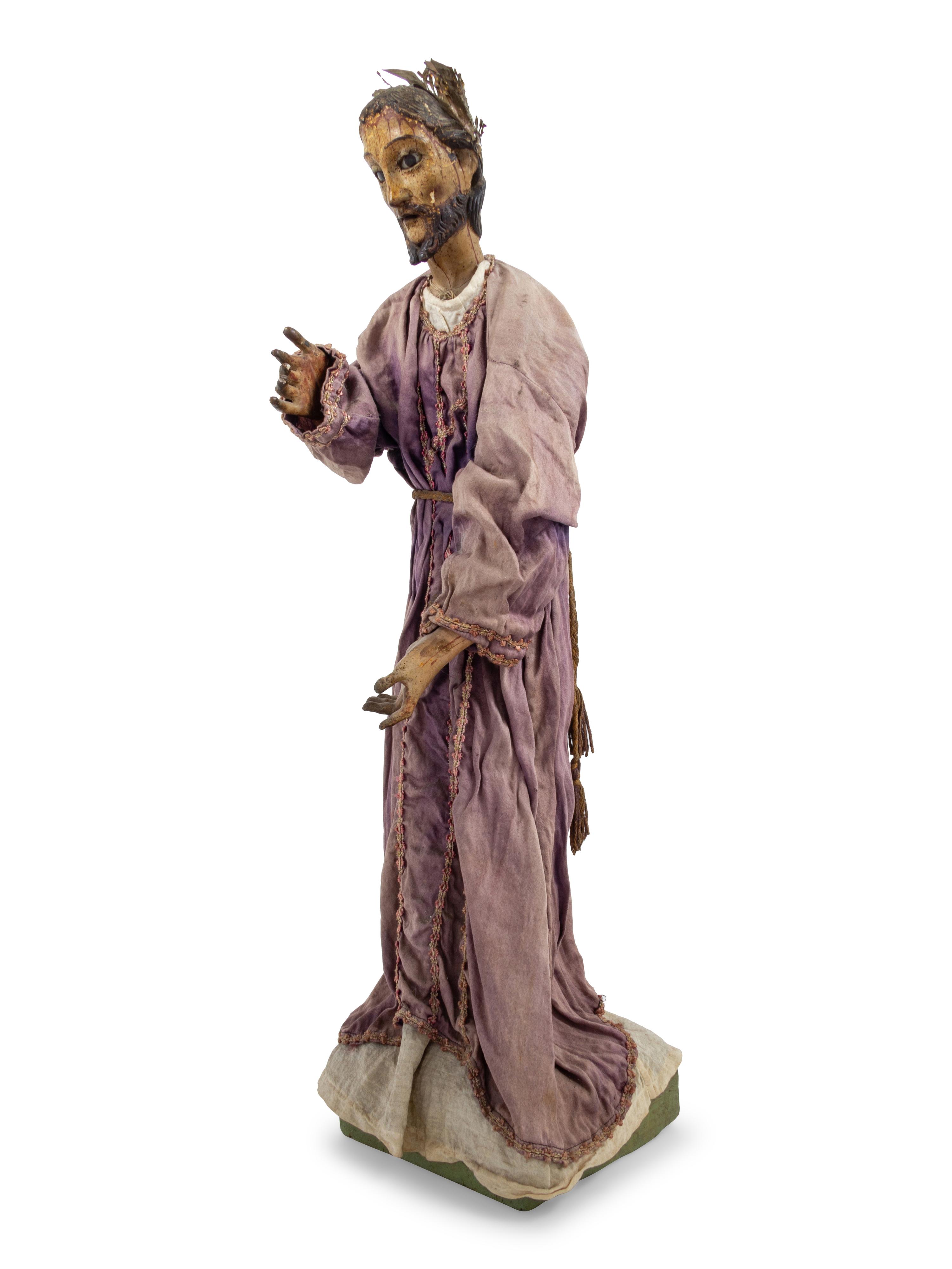A Continental Painted Figure of a Saint