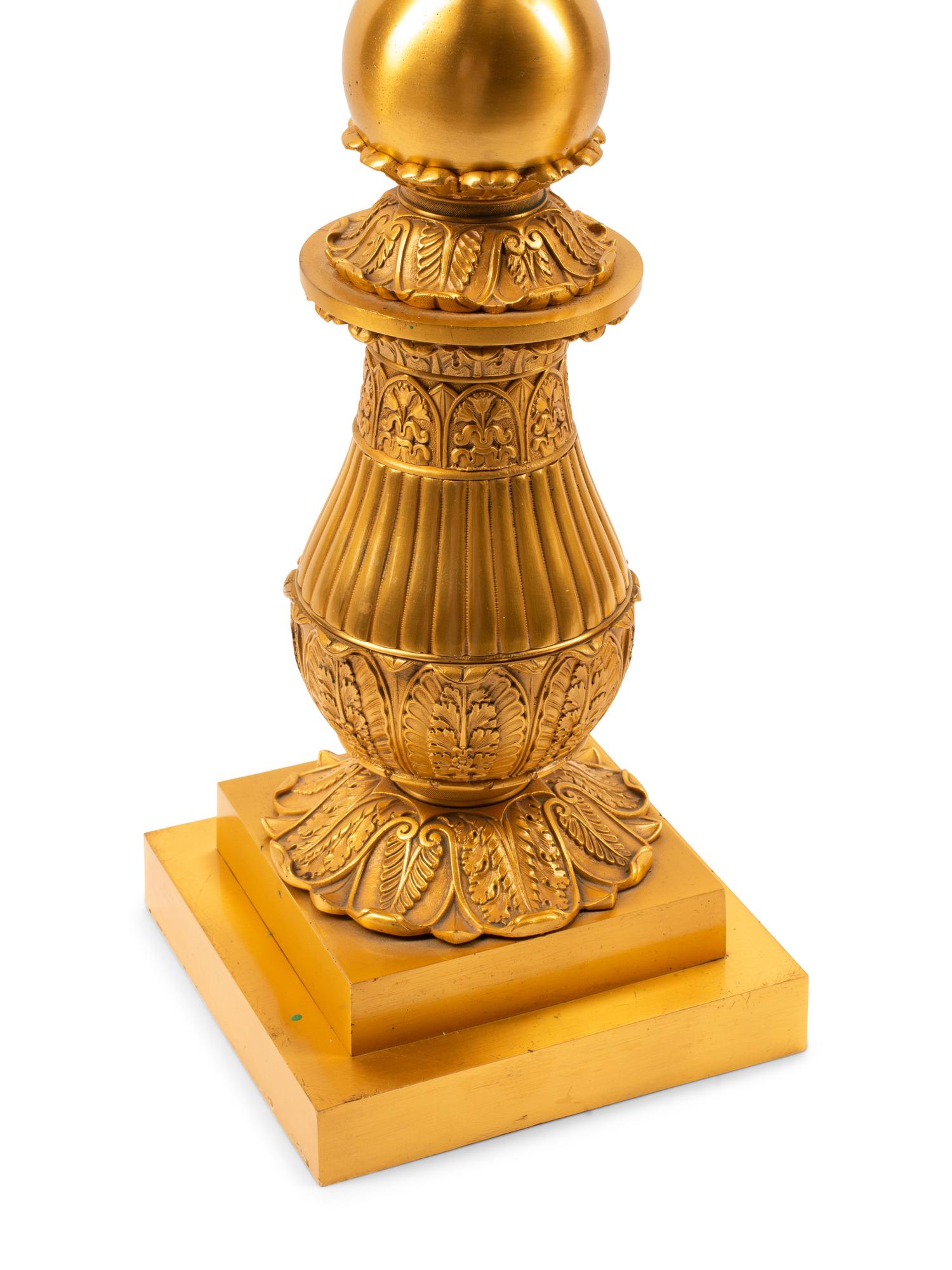 A Pair of Empire Style Gilt and Patinated Bronze Five-Light Candelabra