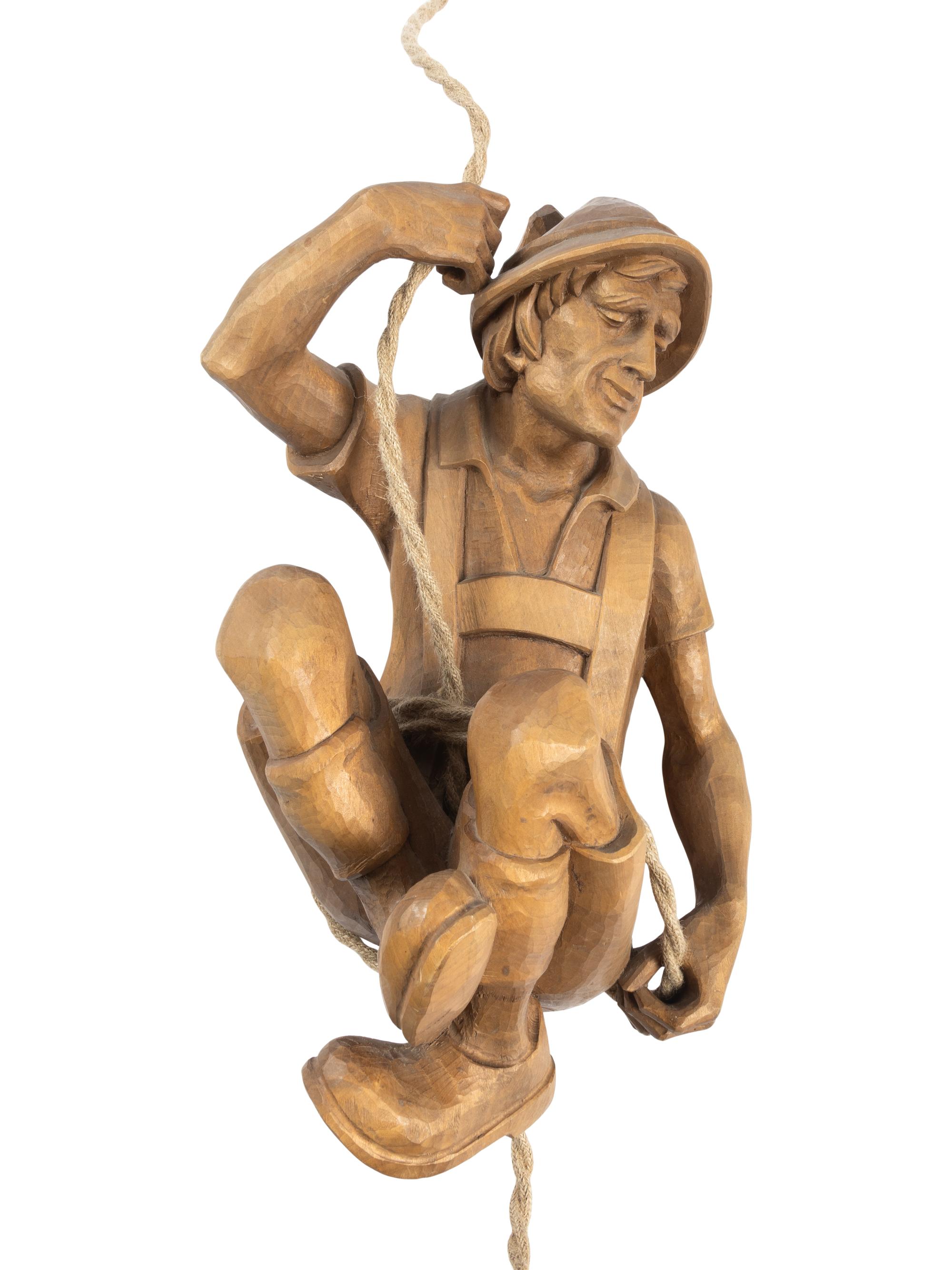 A Swiss Carved Wood "Mountain Climber" Lamp