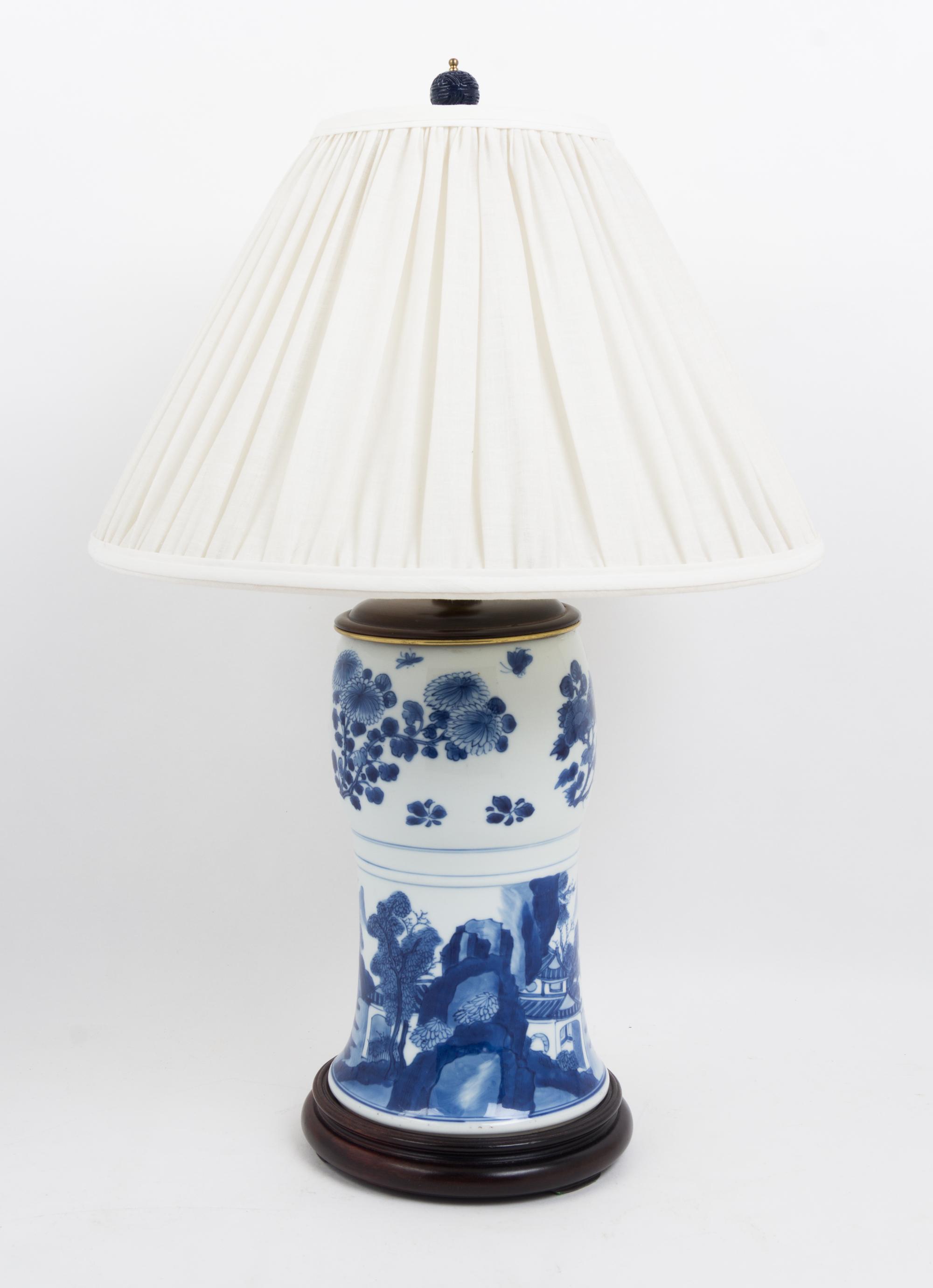 A Pair of Chinese Blue and White Porcelain Vases Height overall 24 1/2 inches.