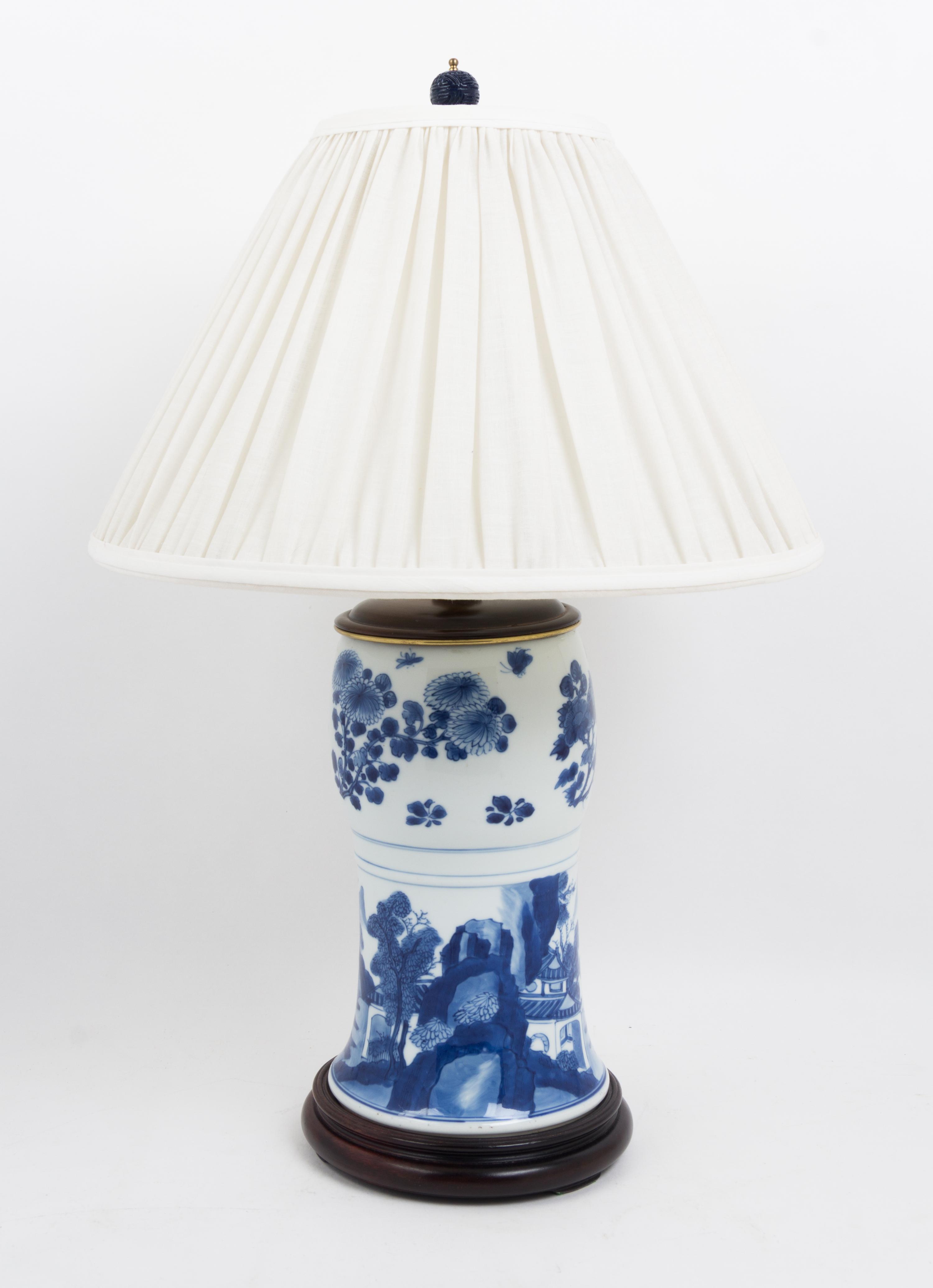 A Pair of Chinese Blue and White Porcelain Vases Height overall 24 1/2 inches.