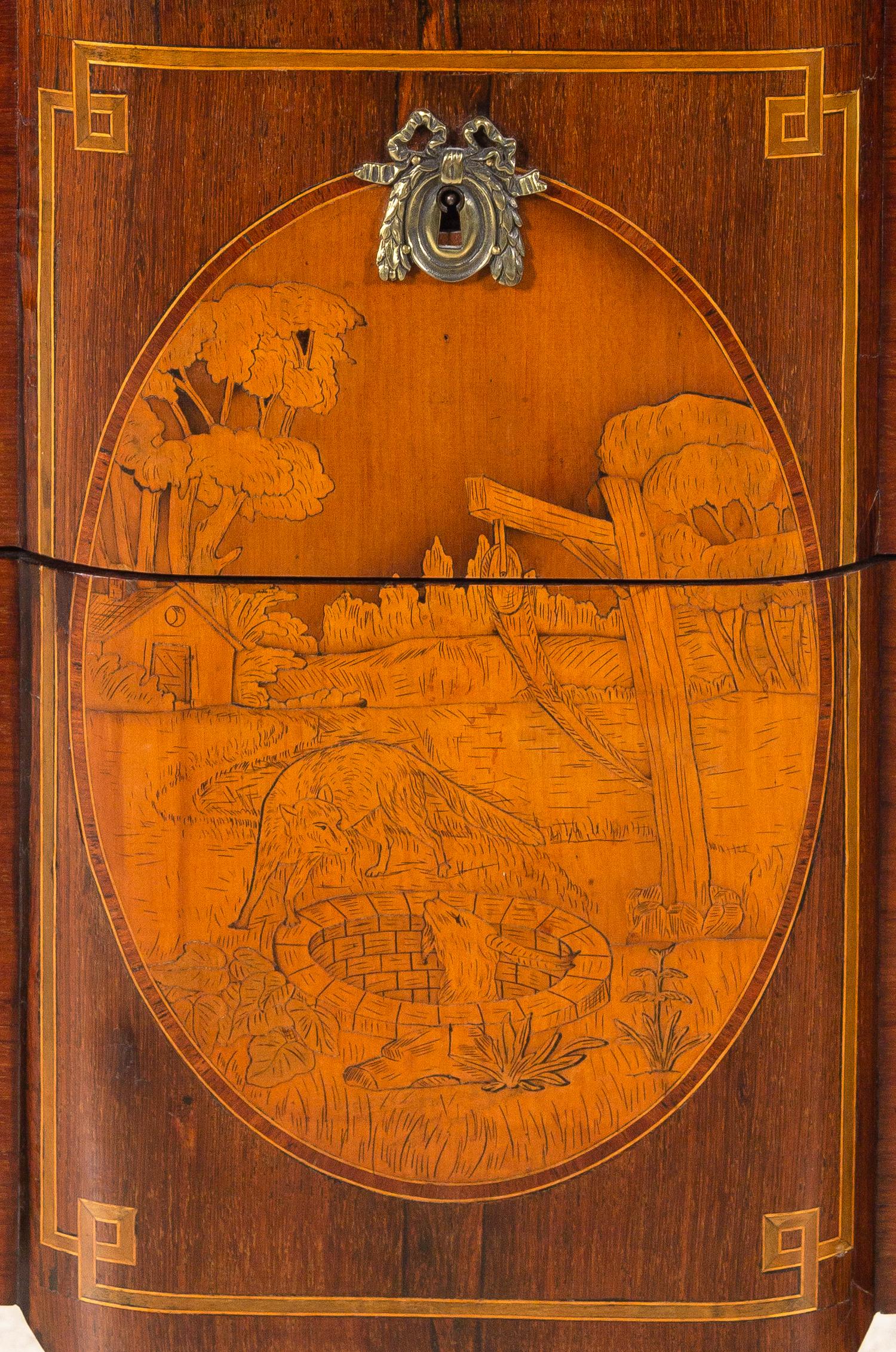 A Louis XV/XVI Transitional Style Marquetry Chest of Drawers