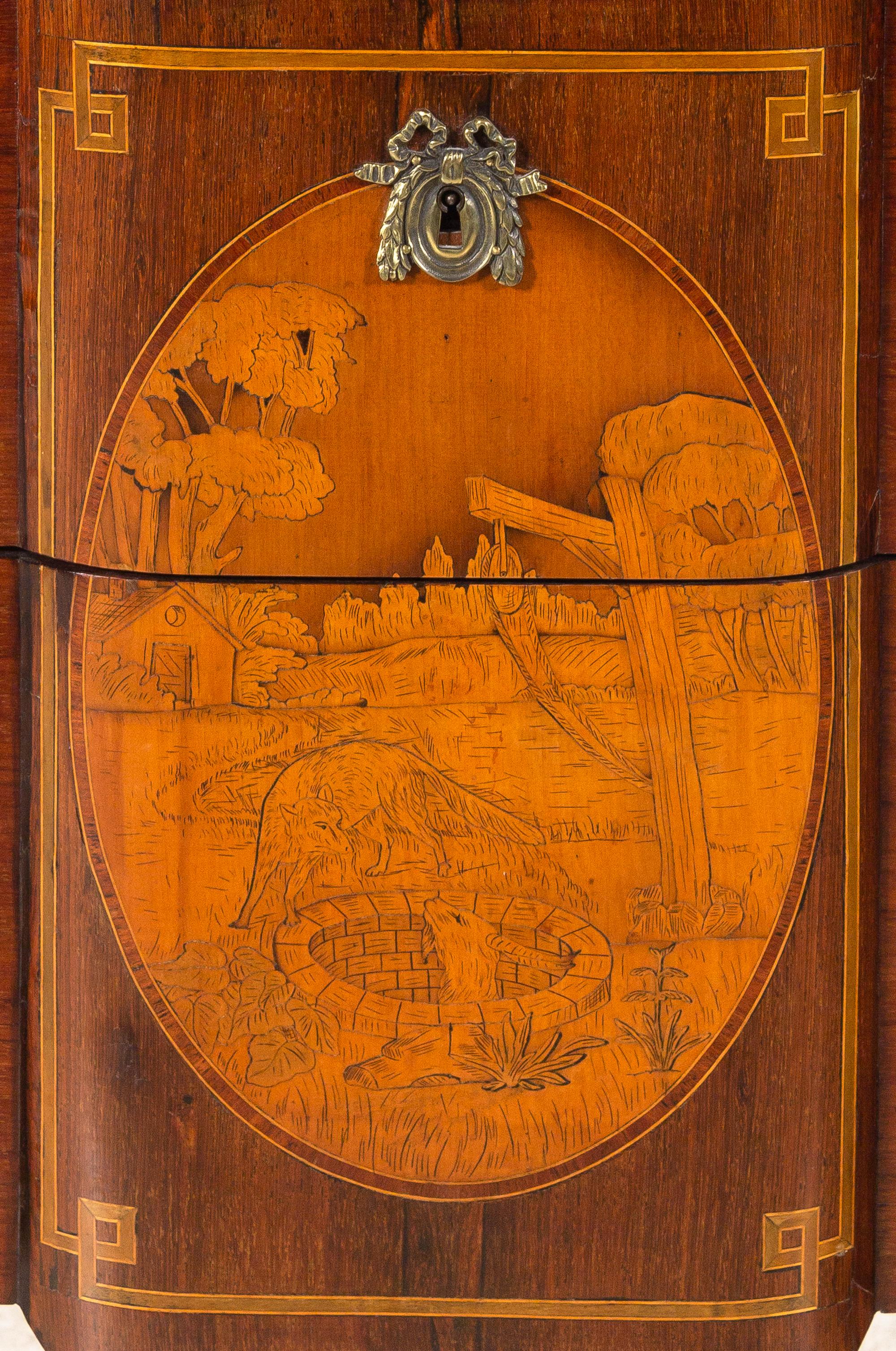 A Louis XV/XVI Transitional Style Marquetry Chest of Drawers