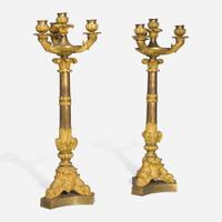 A pair of large French Louis Philippe ormolu candlesticks circa 1830-1840