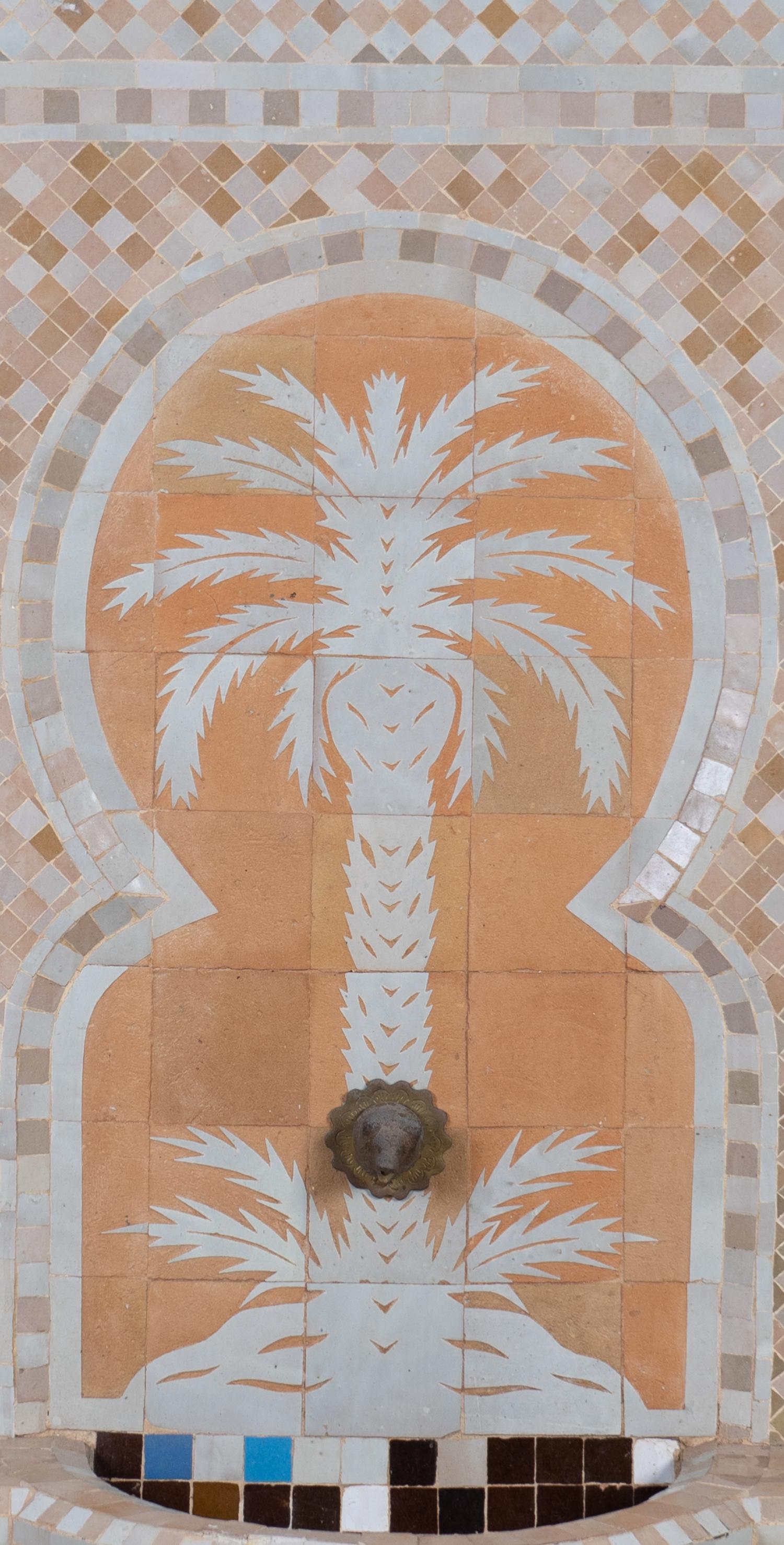 A Mosaic Tile Clad Metal Fountain