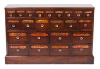 A Twenty-Three Drawer Apothecary Cabinet Height 33 x width 50 1/2 x depth 10 inches.
