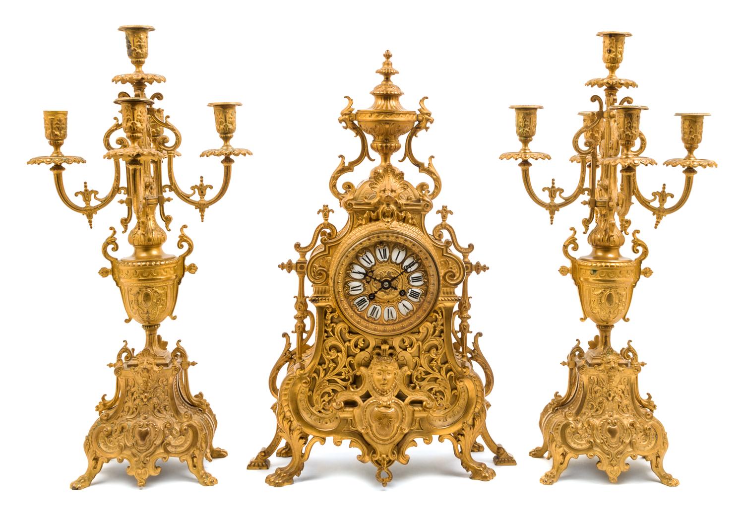 A Neoclassical Style Gilt Bronze Clock Garniture Height of candelabra 22 inches. — LATE 19TH CENTURY