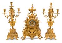 A Neoclassical Style Gilt Bronze Clock Garniture Height of candelabra 22 inches. — LATE 19TH CENTURY