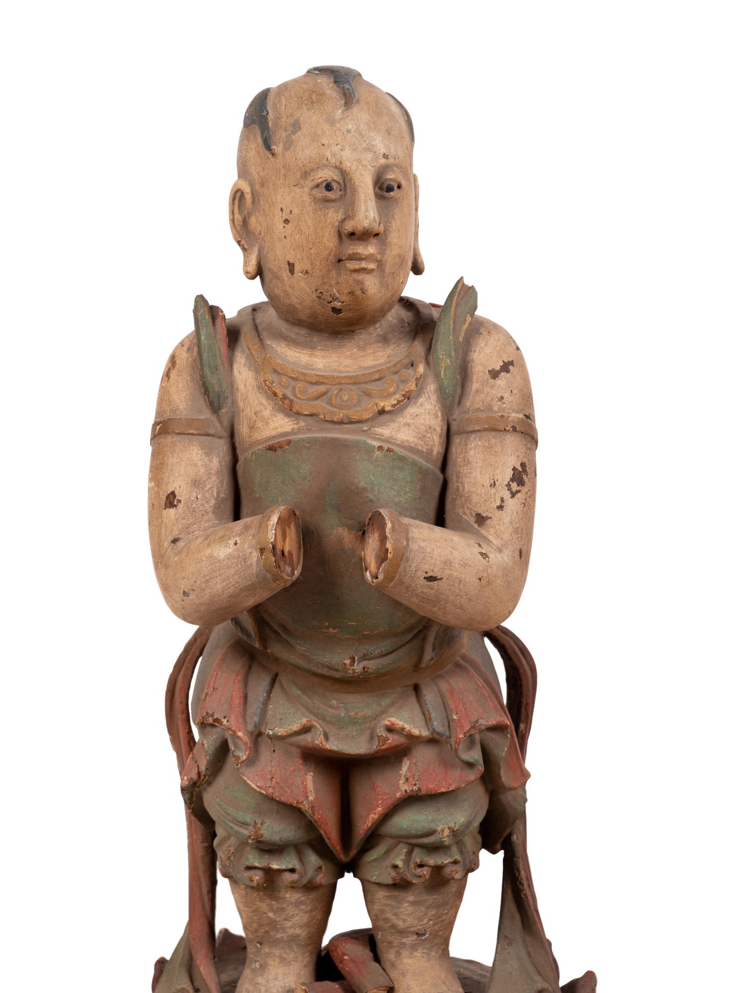 A Chinese Carved Wood Standing Figure with Polychrome Decoration