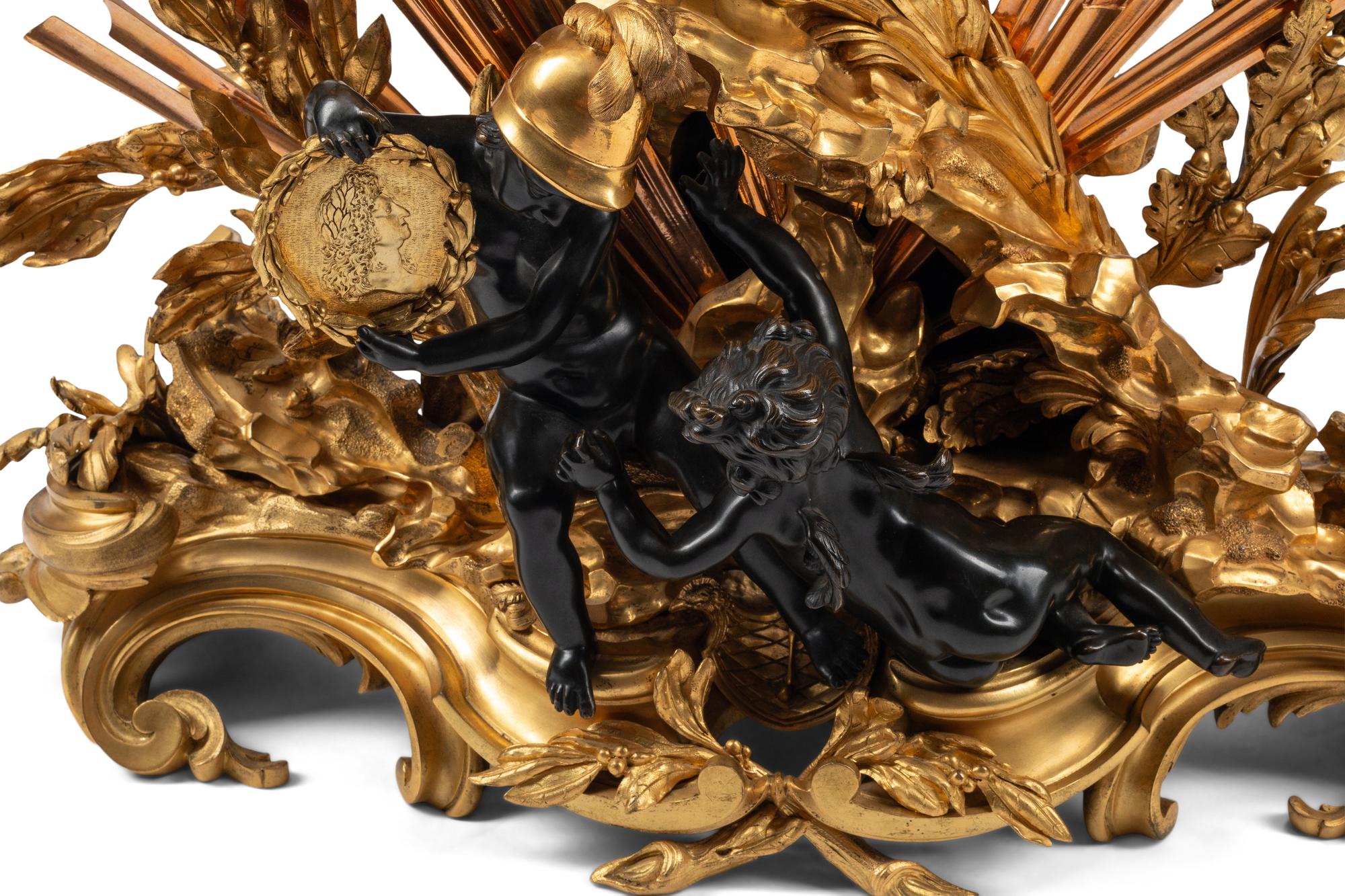 A French Gilt and Patinated Bronze Pendule à la Gloire du Roi