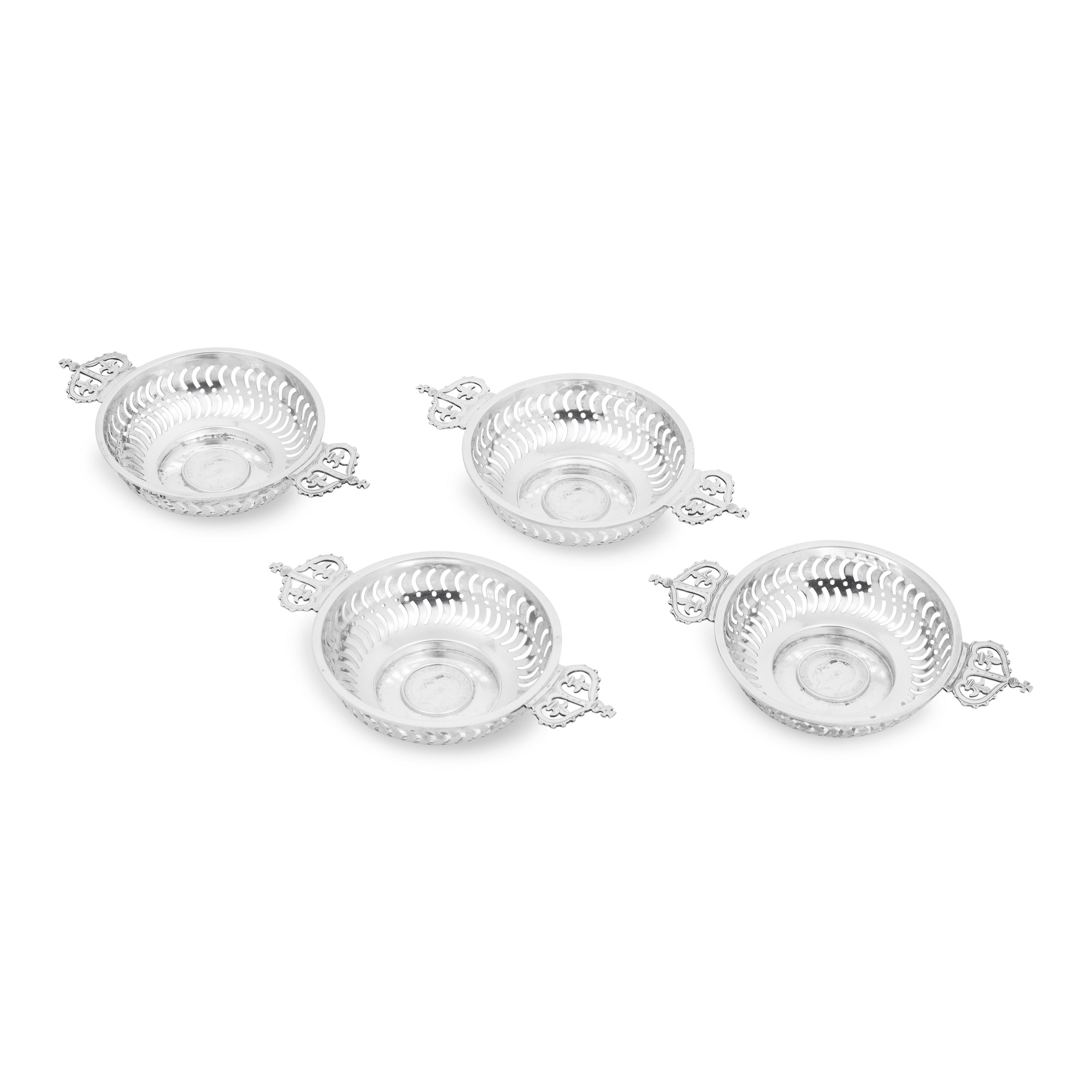 A Set of Four English Silver Coin-Inset Nut Dishes