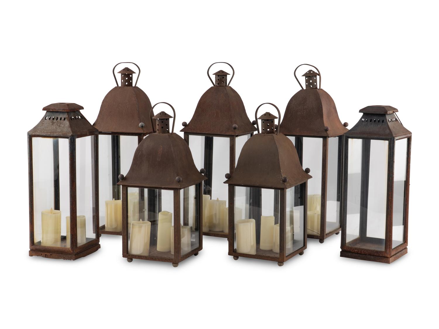 A Group of Eight Patinated Sheet Metal Garden Lanterns