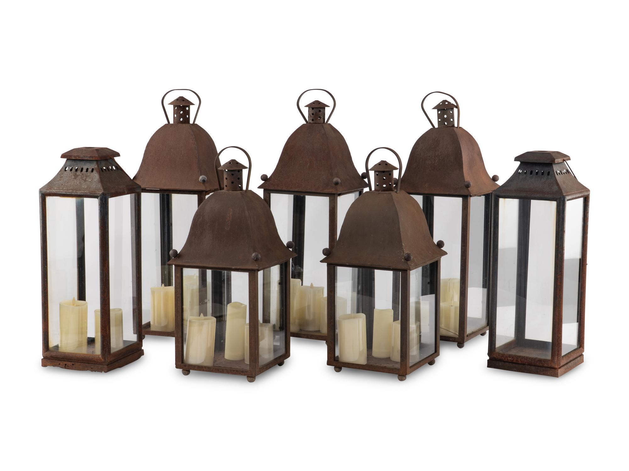 A Group of Eight Patinated Sheet Metal Garden Lanterns