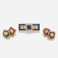 A gold, sapphire, and diamond brooch with similar cufflinks