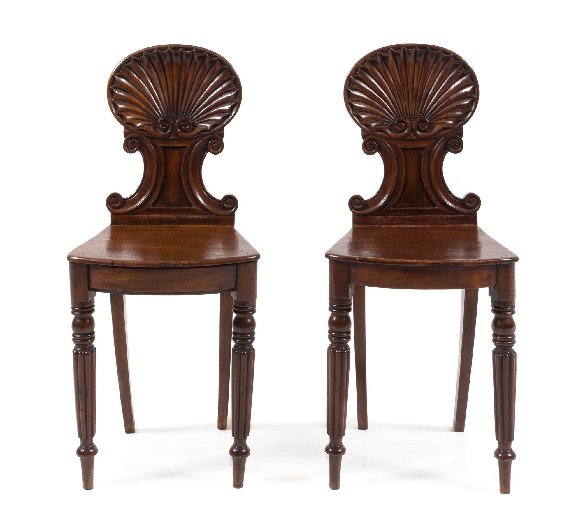 A Pair of Regency Mahogany Hall Chairs Height 34 1/8 inches. — 19TH CENTURY