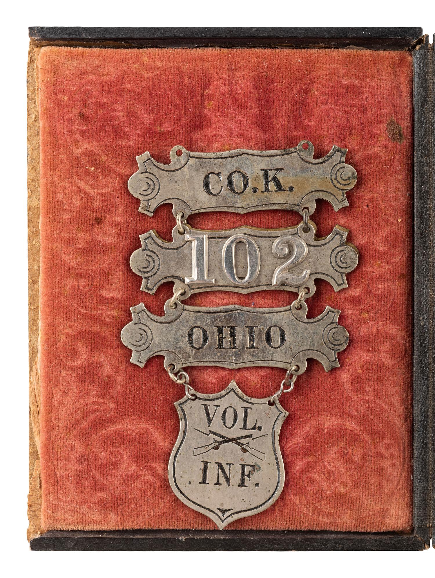 [CIVIL WAR]. Quarter plate tintype portrait attributed as David Kiplinger, Co. K, 102nd Ohio Infantry Regiment, accompanied by ladder badge, CDV, and RPPC.