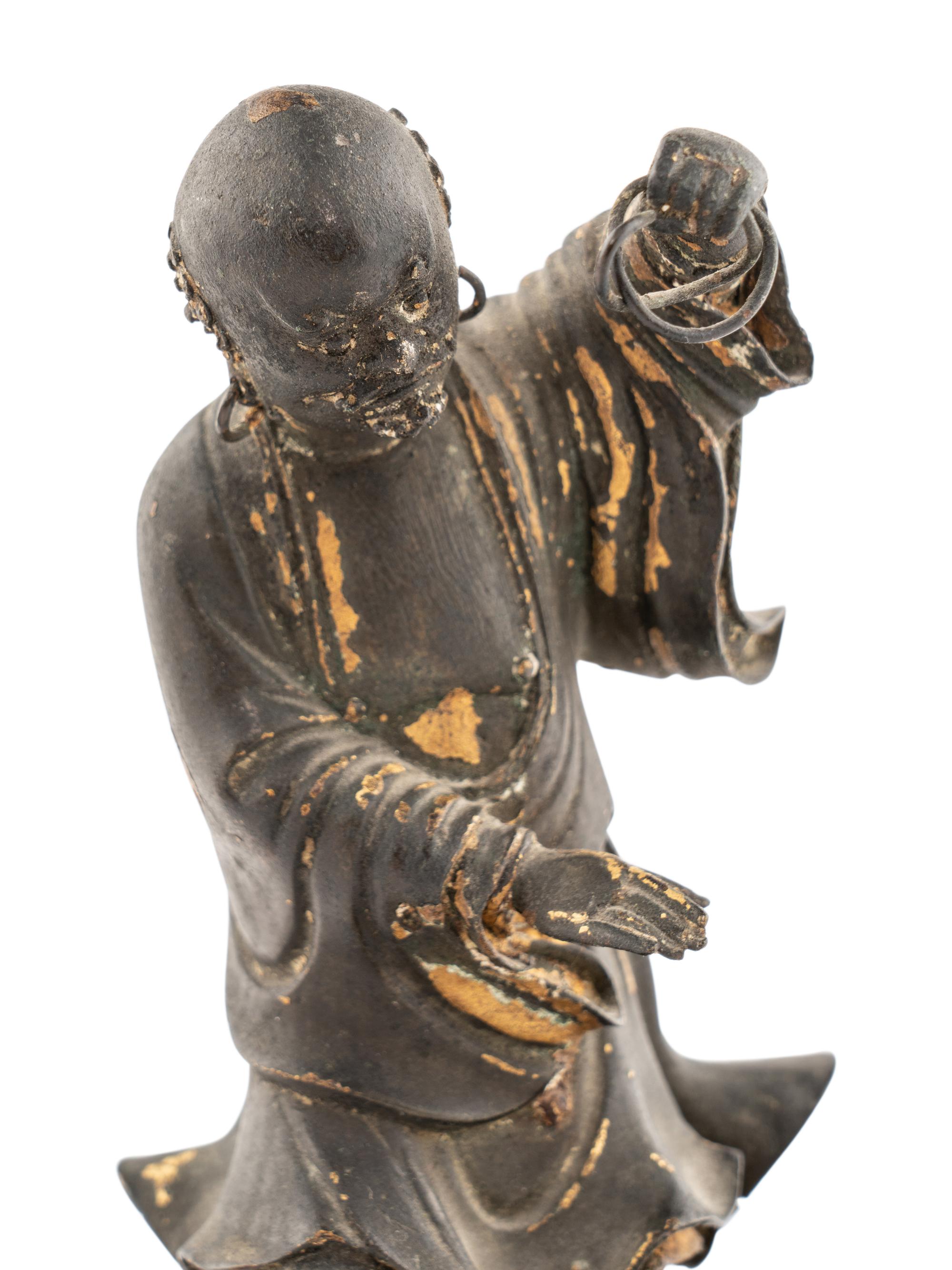 A Pair of Chinese Parcel-Gilt Bronze Figures of Luohan