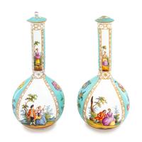 A Pair of German Porcelain Covered Vases
