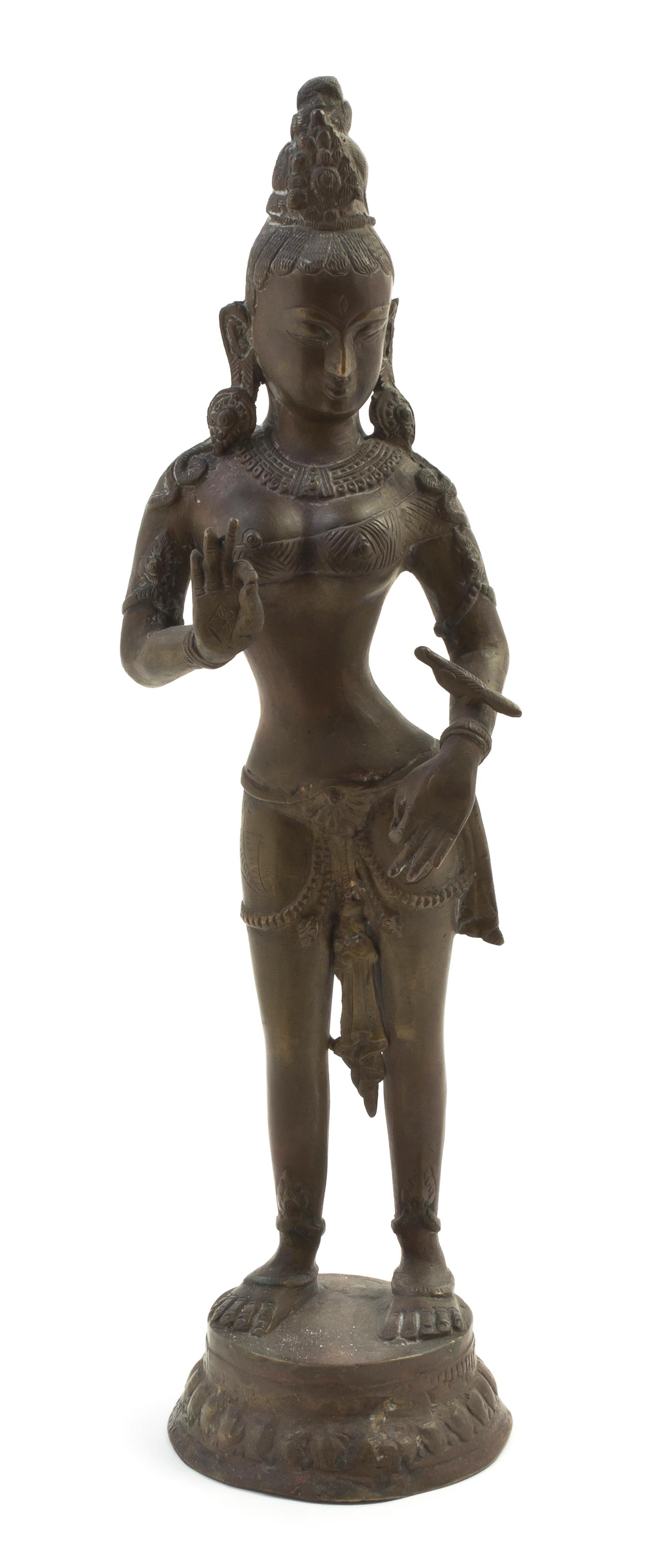 An Indian Bronze Standing Deity, Height overall 17 1/2 inches.