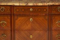 A French Gilt Metal Mounted Mahogany and Kingwood Marquetry Marble-Top Commode