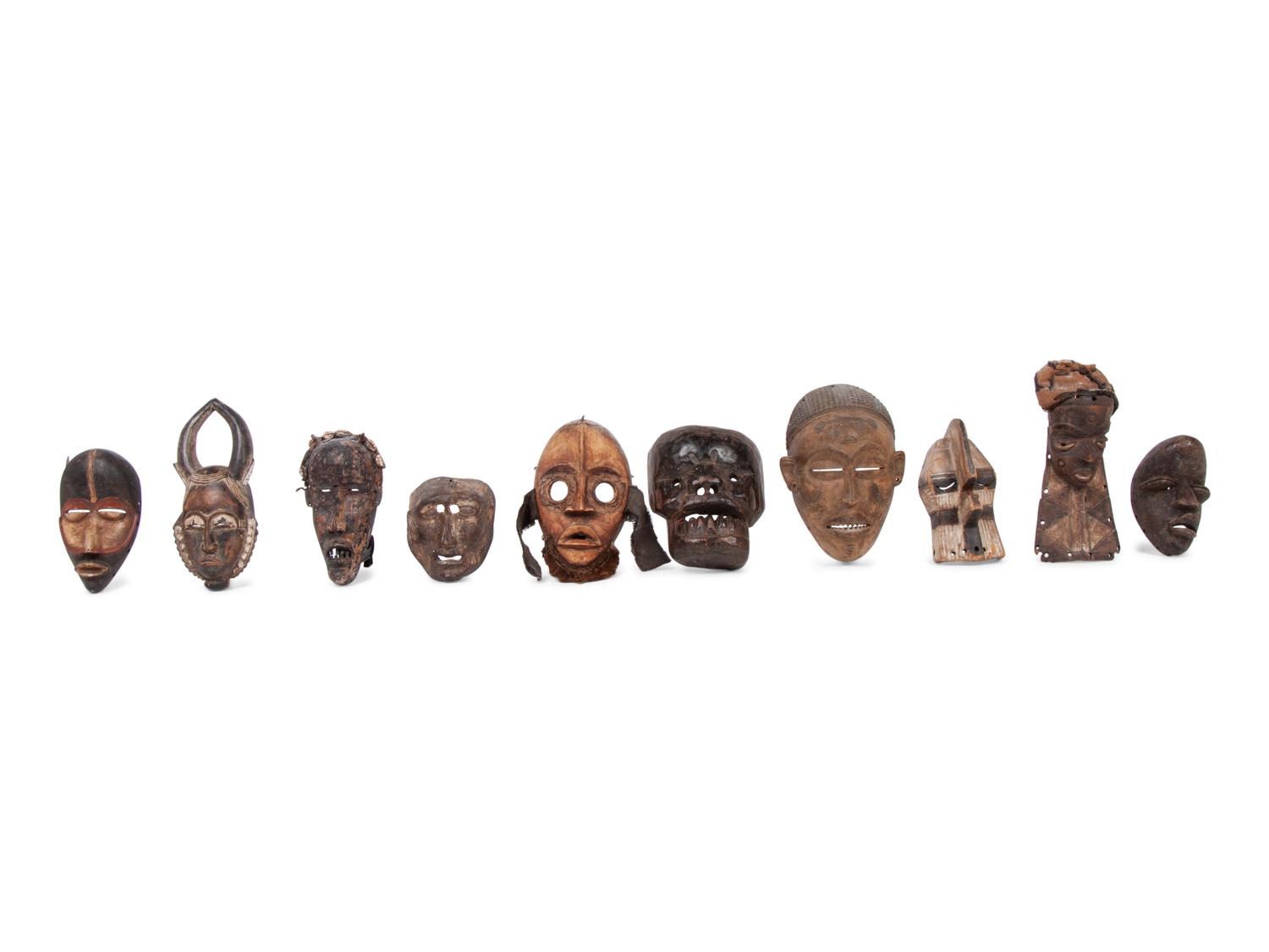 A Group of Ten Carved Ethnographic Masks