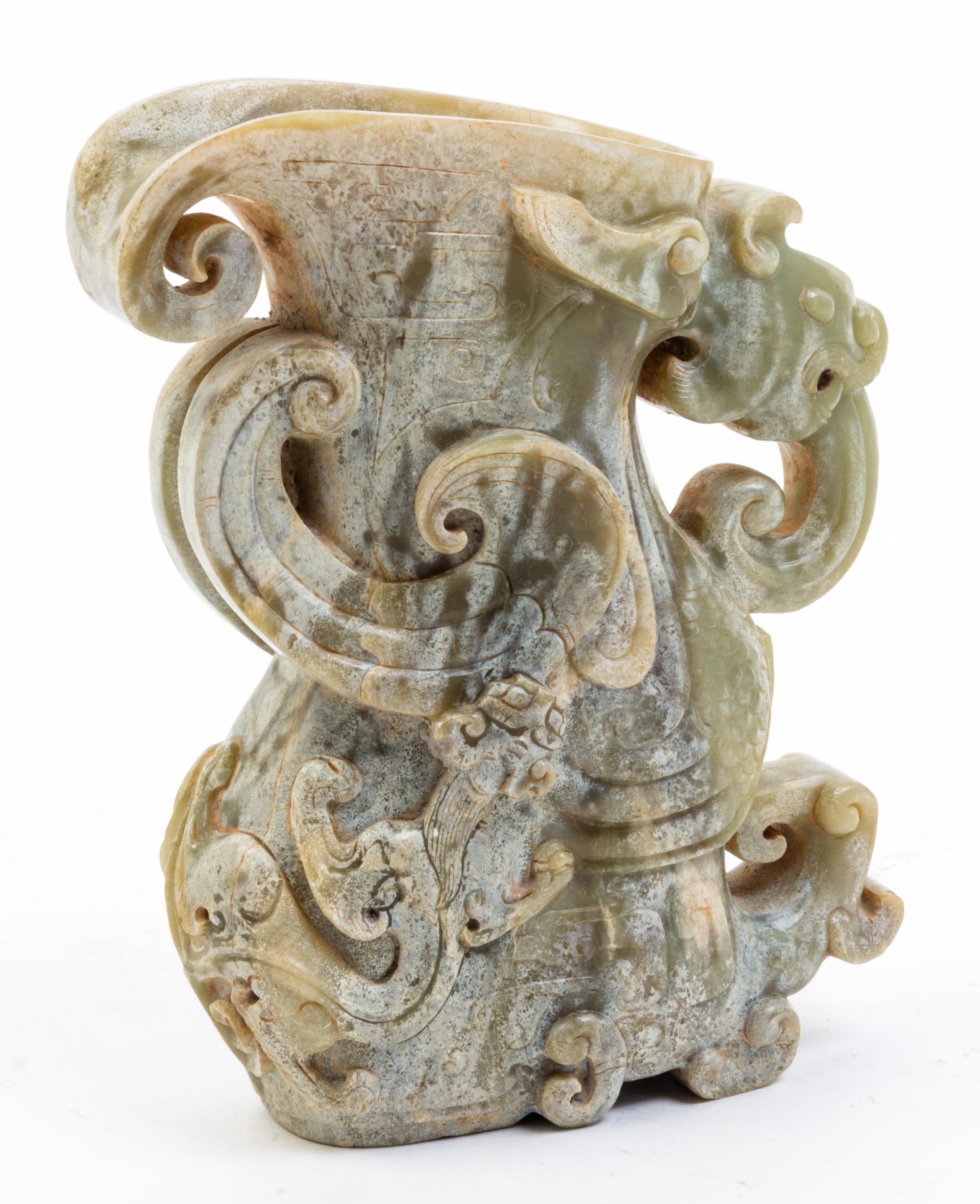 A Jade Rhyton Cup. Height 5 1/2 inches.