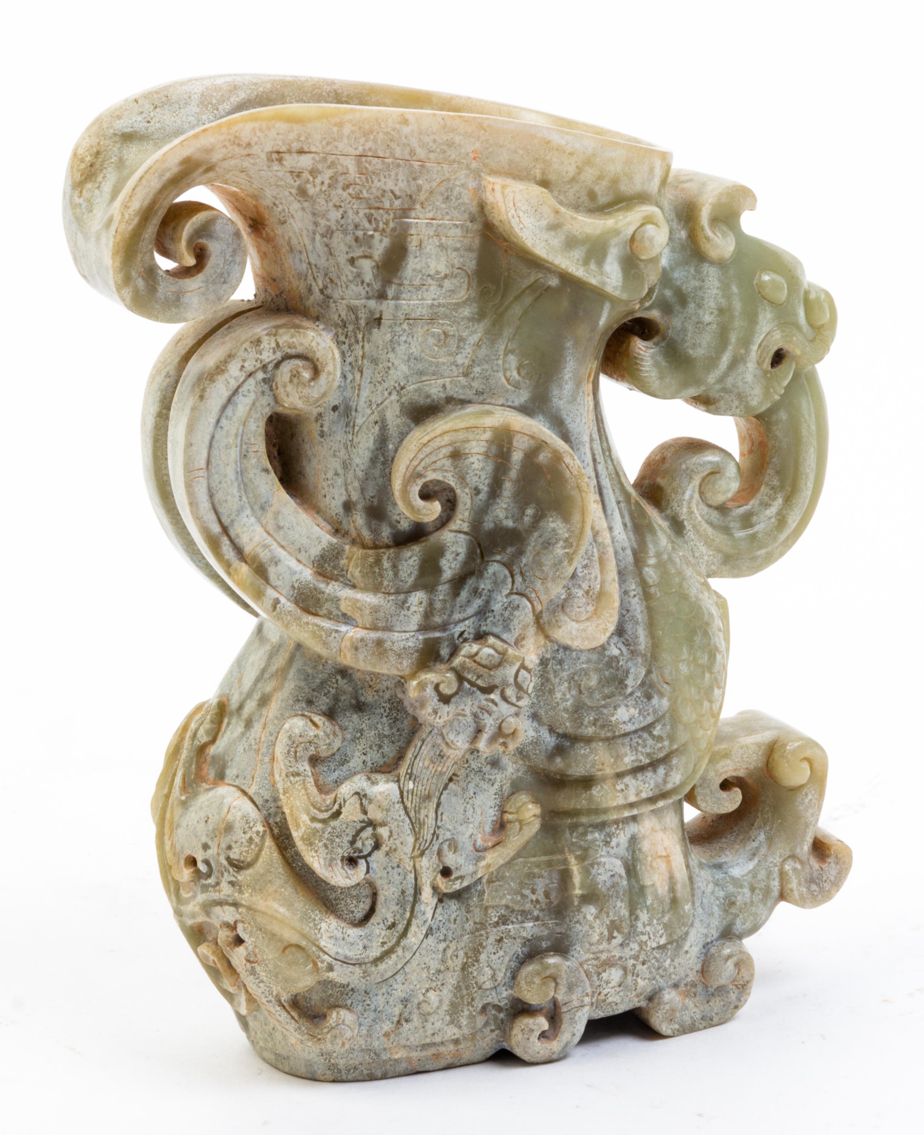 A Jade Rhyton Cup. Height 5 1/2 inches.