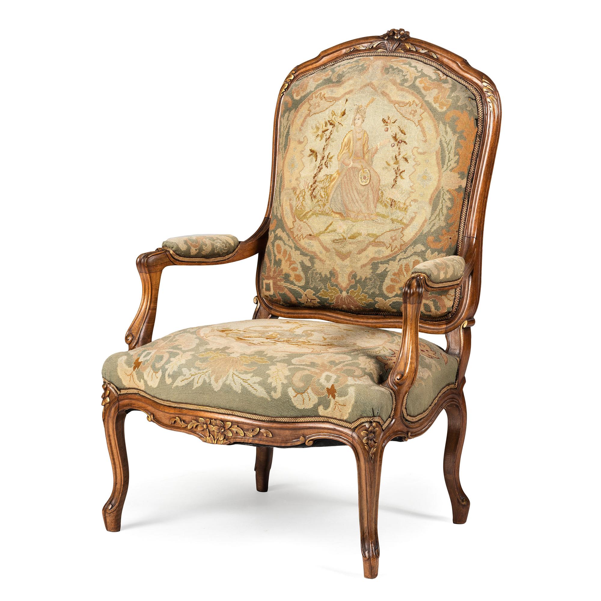 A Louis XV Style Carved Walnut and Needlework Upholstered Fauteuil