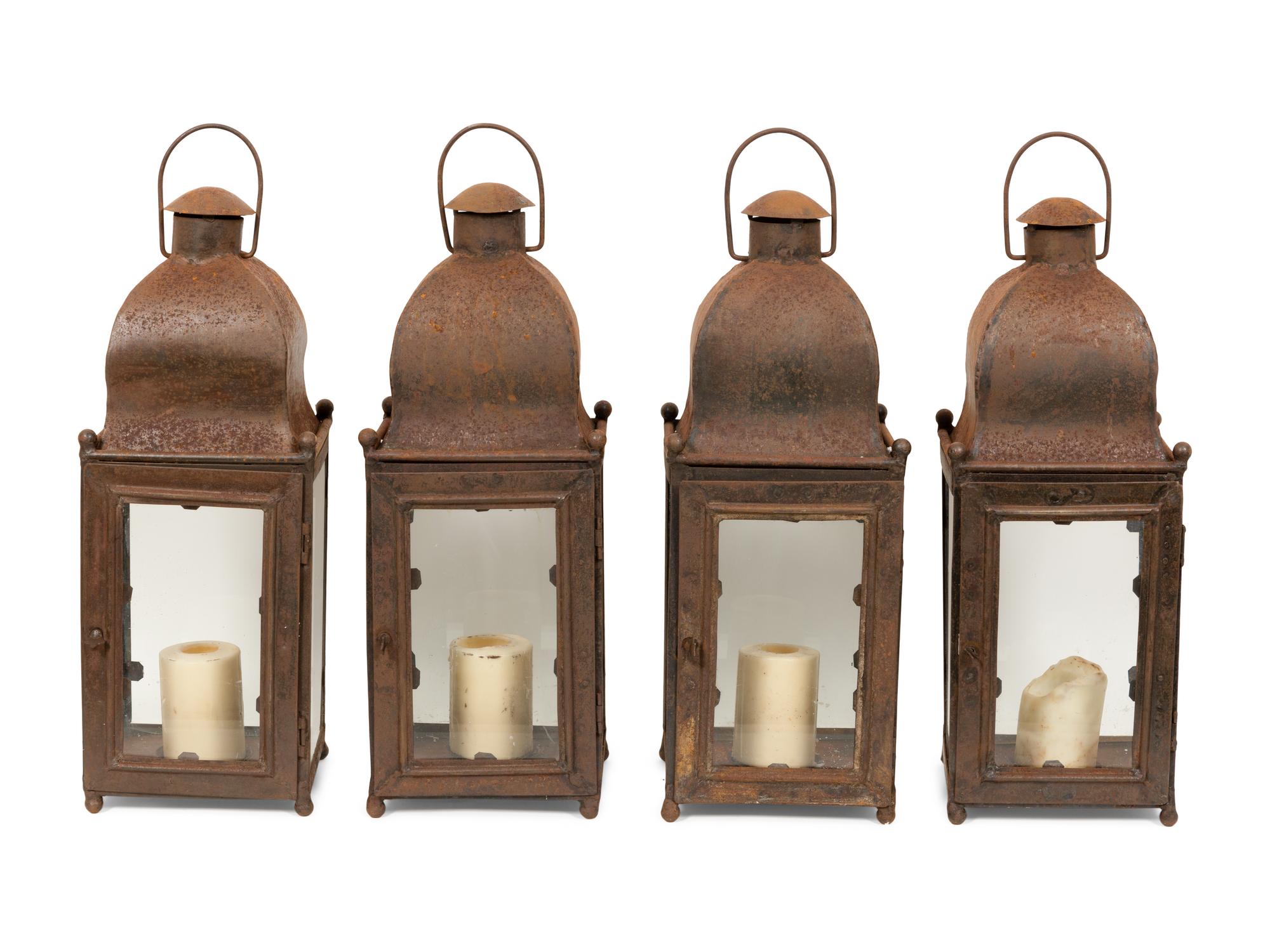 A Set of Four Weathered Steel Lanterns