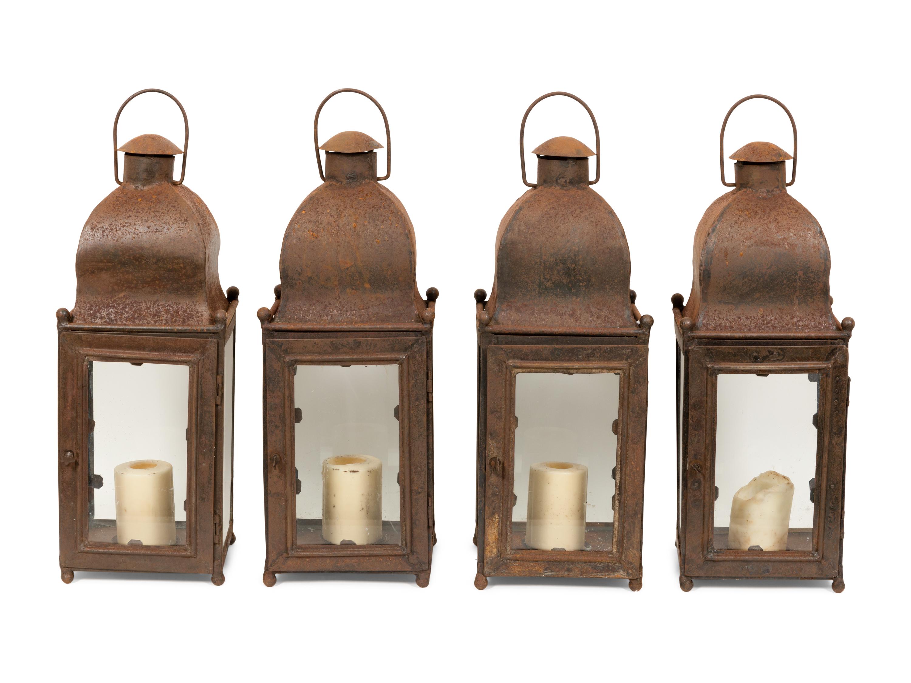 A Set of Four Weathered Steel Lanterns