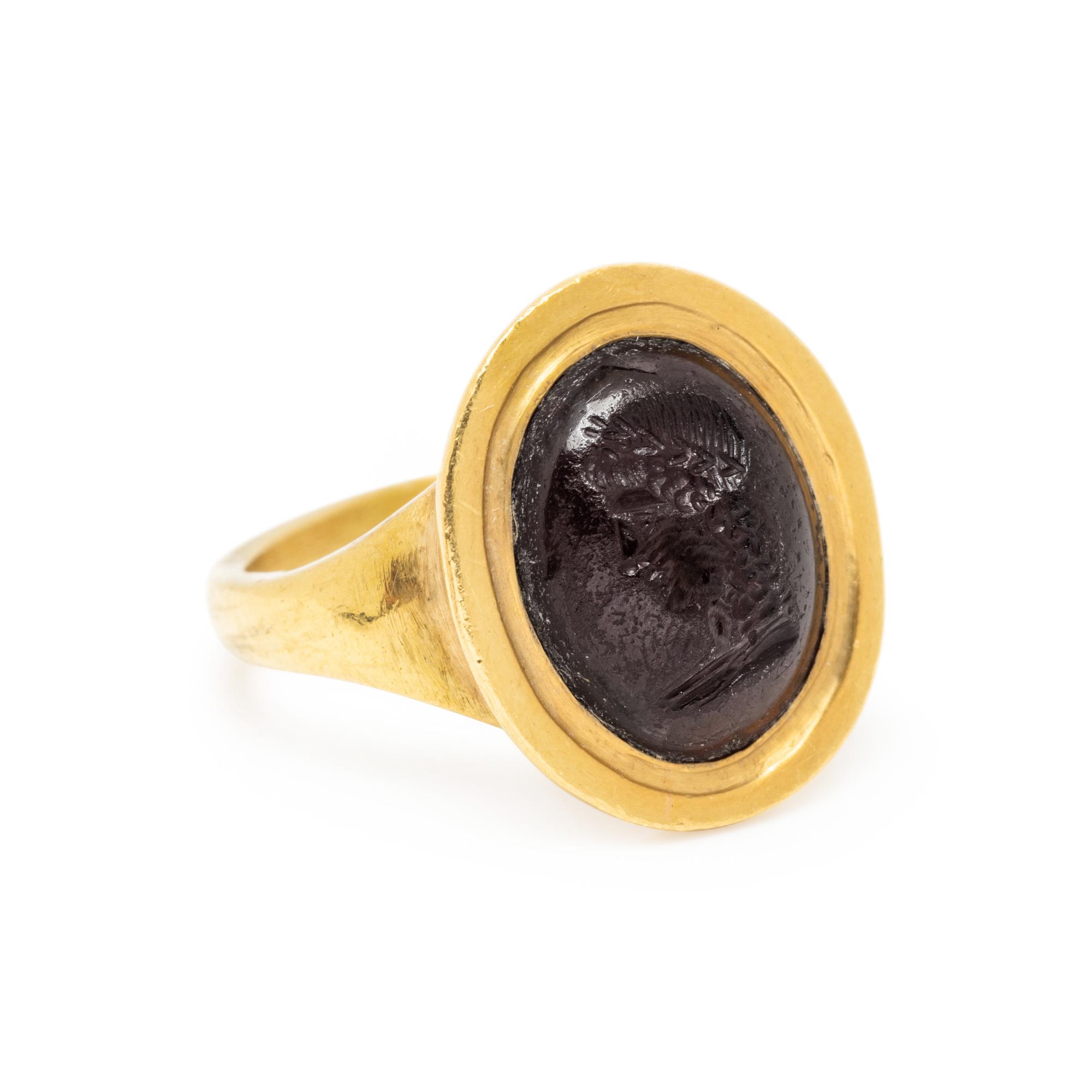 ATTILIO CODOGNATO, YELLOW GOLD AND GARNET INTAGLIO RING
