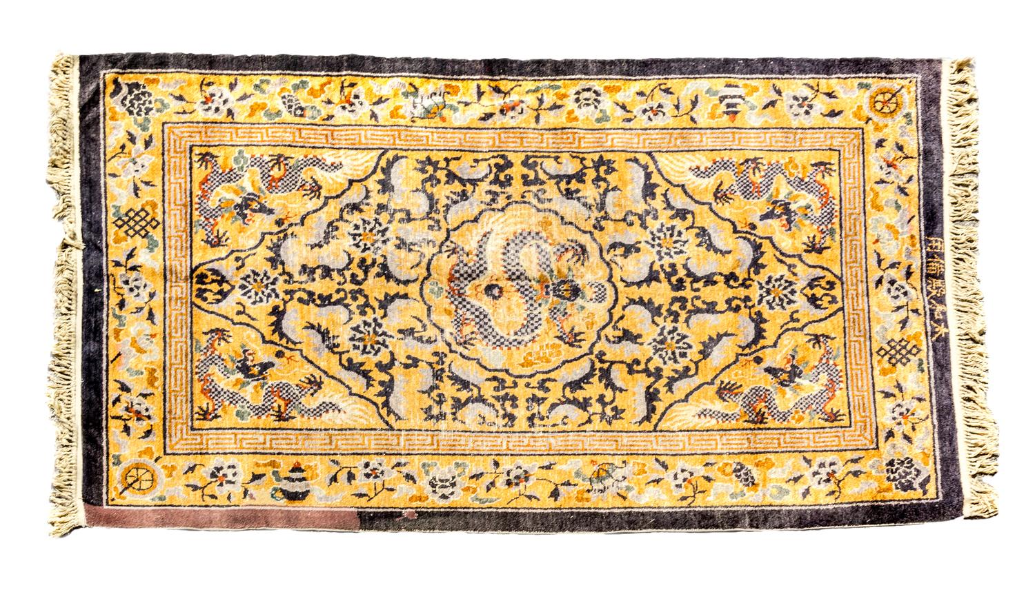 A Chinese Rug 7 feet 11 1/2 inches x 4 feet 9 inches.