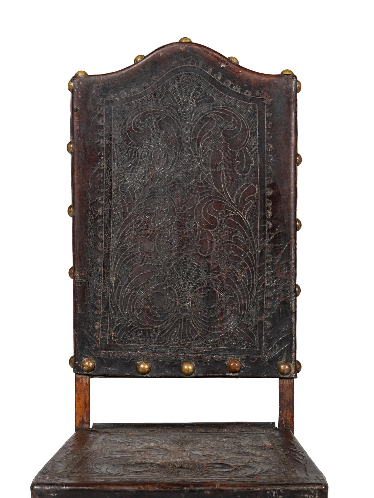 Six Mizner Carved Walnut and Embossed Leather Back Side Chairs